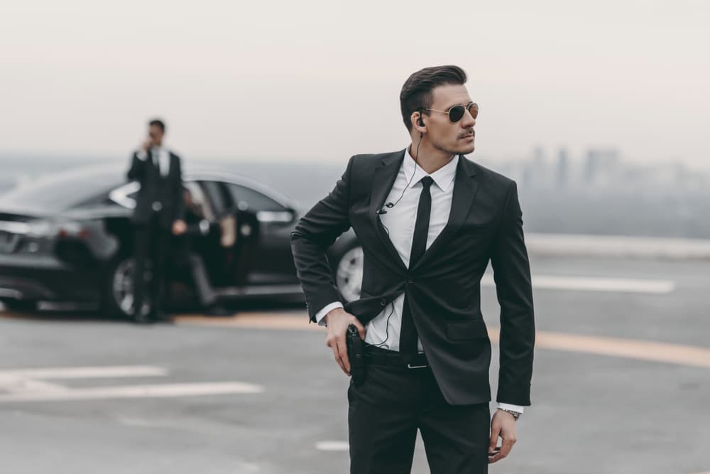 Executive protection professional accompanying a traveler